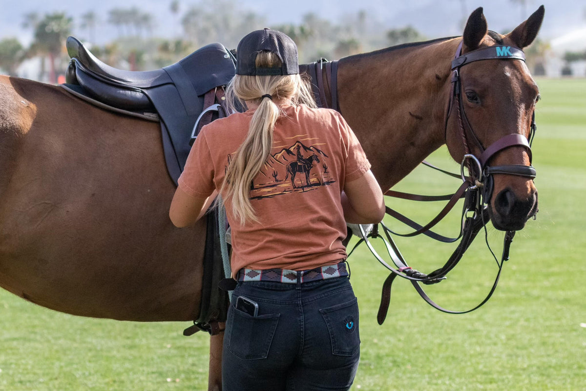 Woman and Horse showing the Turmalina Polo Black Pants.