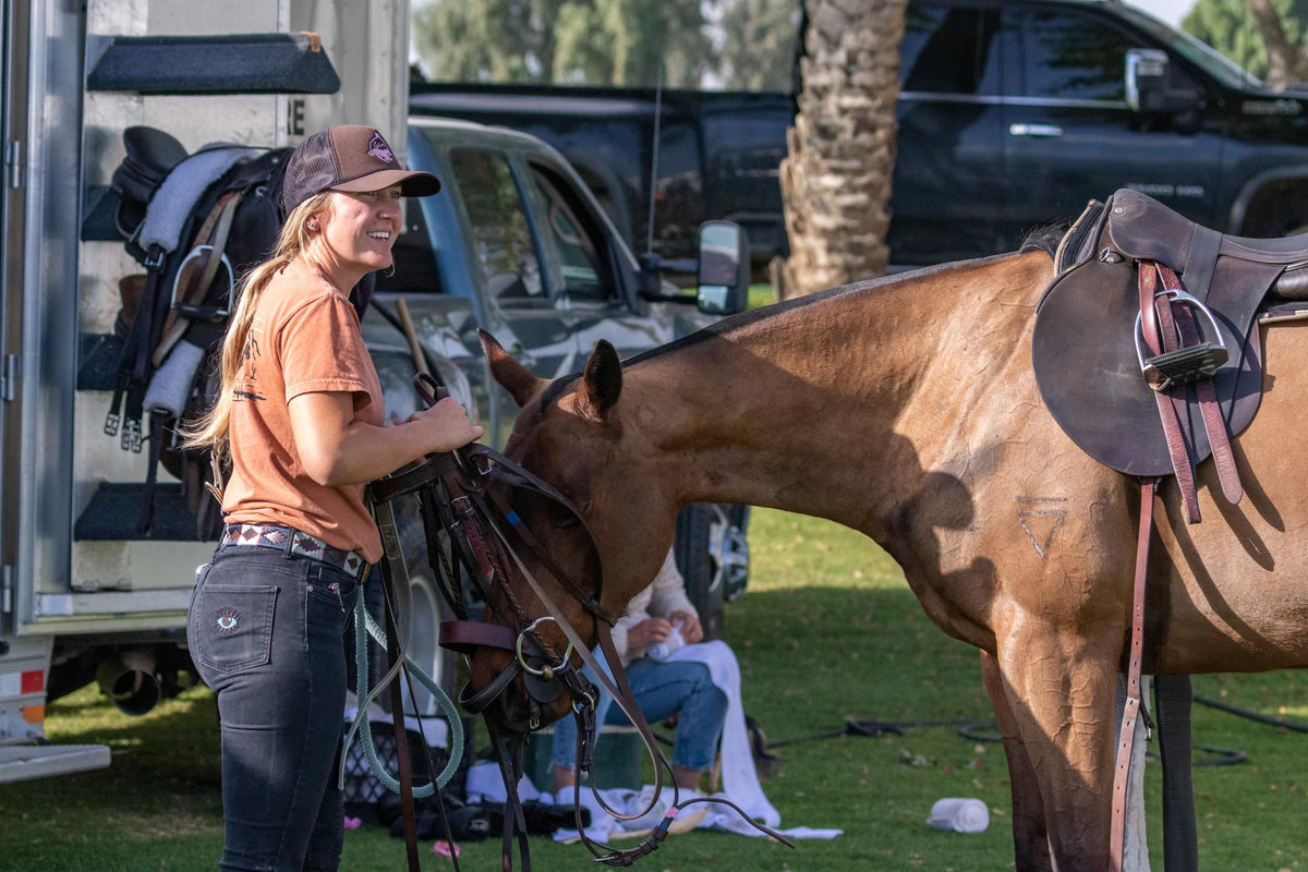 Woman wearing Turmalina Black Polo Pants.