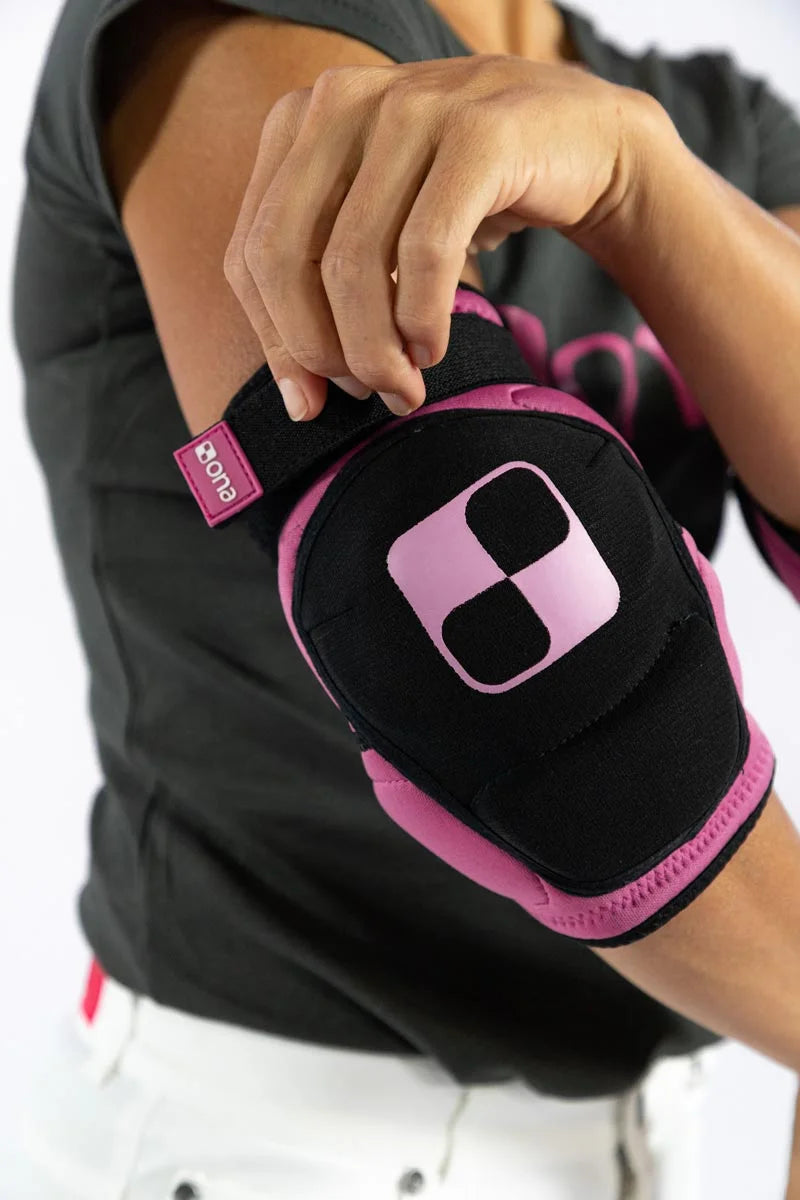 Person wearing Ona Elbow Guards in pink